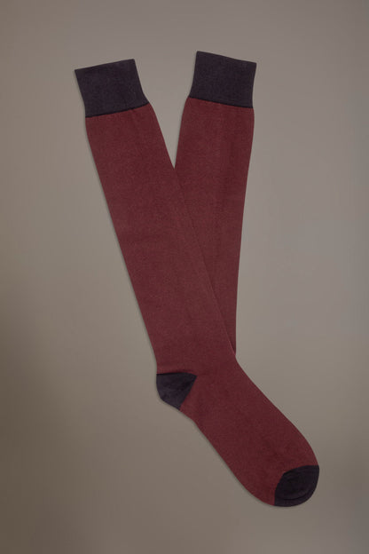 Long solid color socks in stockinette stitch made in Italy