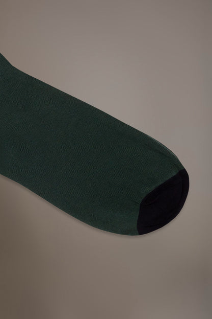 Long solid color socks in stockinette stitch made in Italy