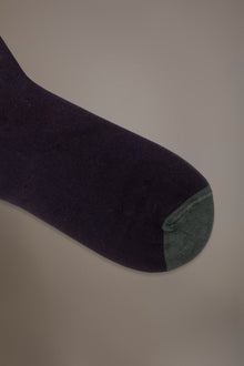 Long solid color socks in stockinette stitch made in Italy