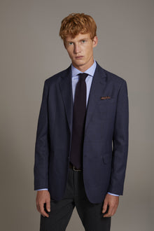 Single-breasted jacket with flap pockets in prince of wales fabric made in Italy