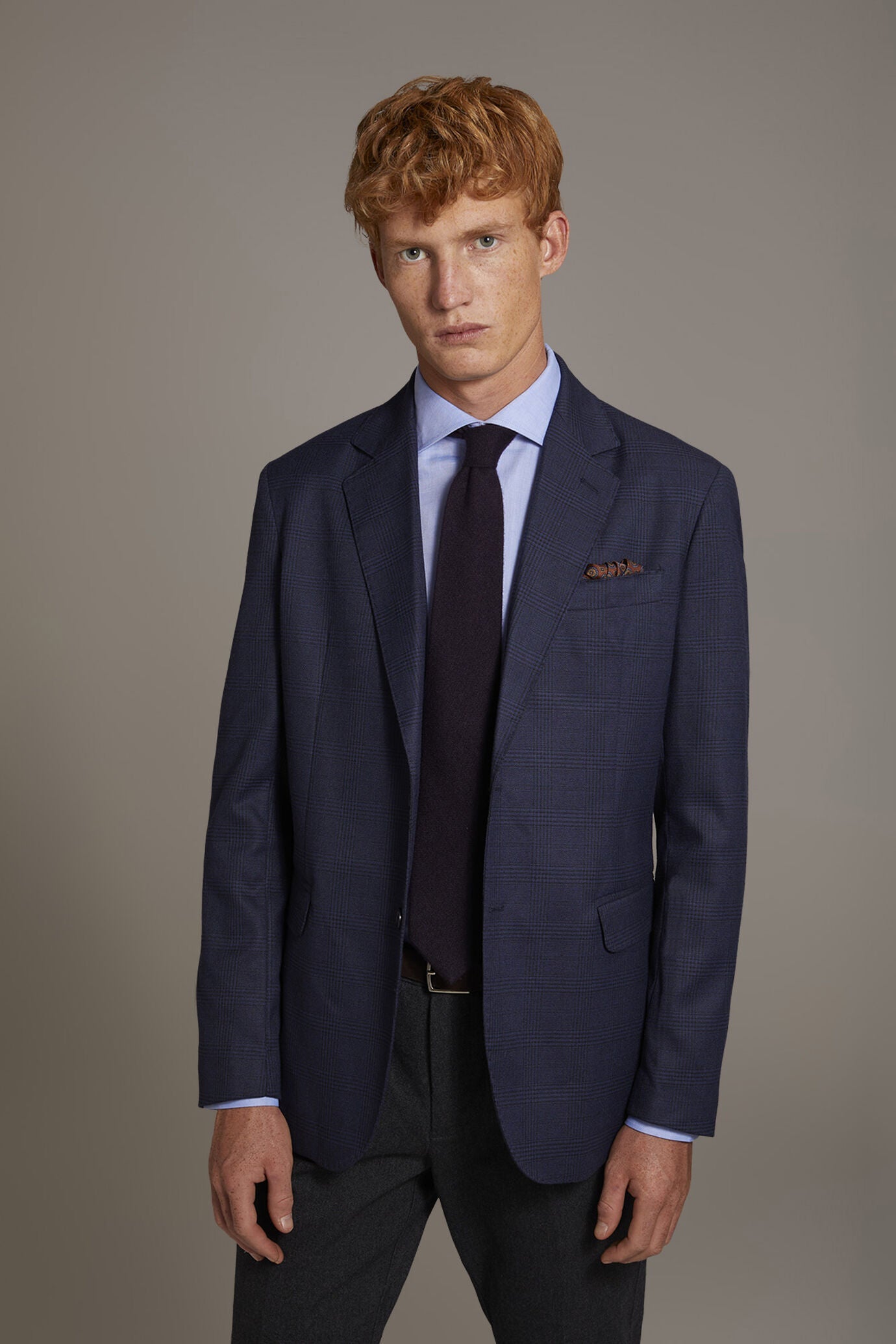 Single-breasted jacket with flap pockets in prince of wales fabric made in Italy