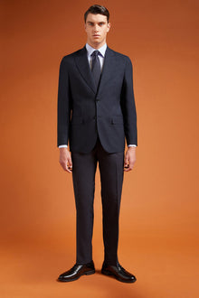 Men's regular fit single-breasted suit featuring a jacket with peak lapels in wool blend fabric