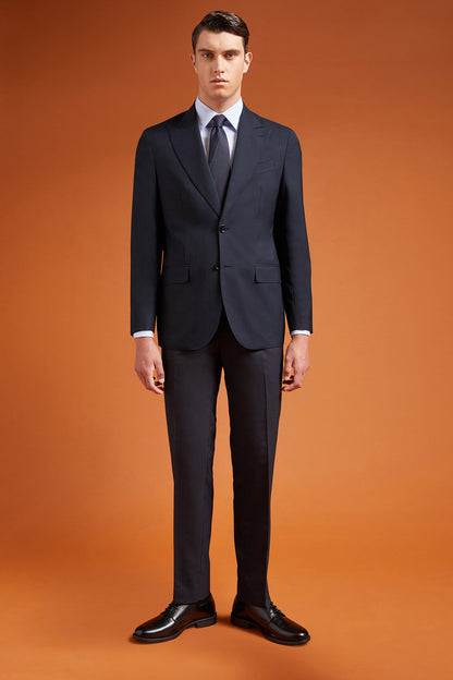 Men's regular fit single-breasted suit featuring a jacket with peak lapels in wool blend fabric