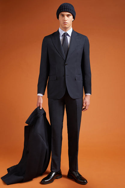 Men's regular fit single-breasted suit featuring a jacket with peak lapels in wool blend fabric