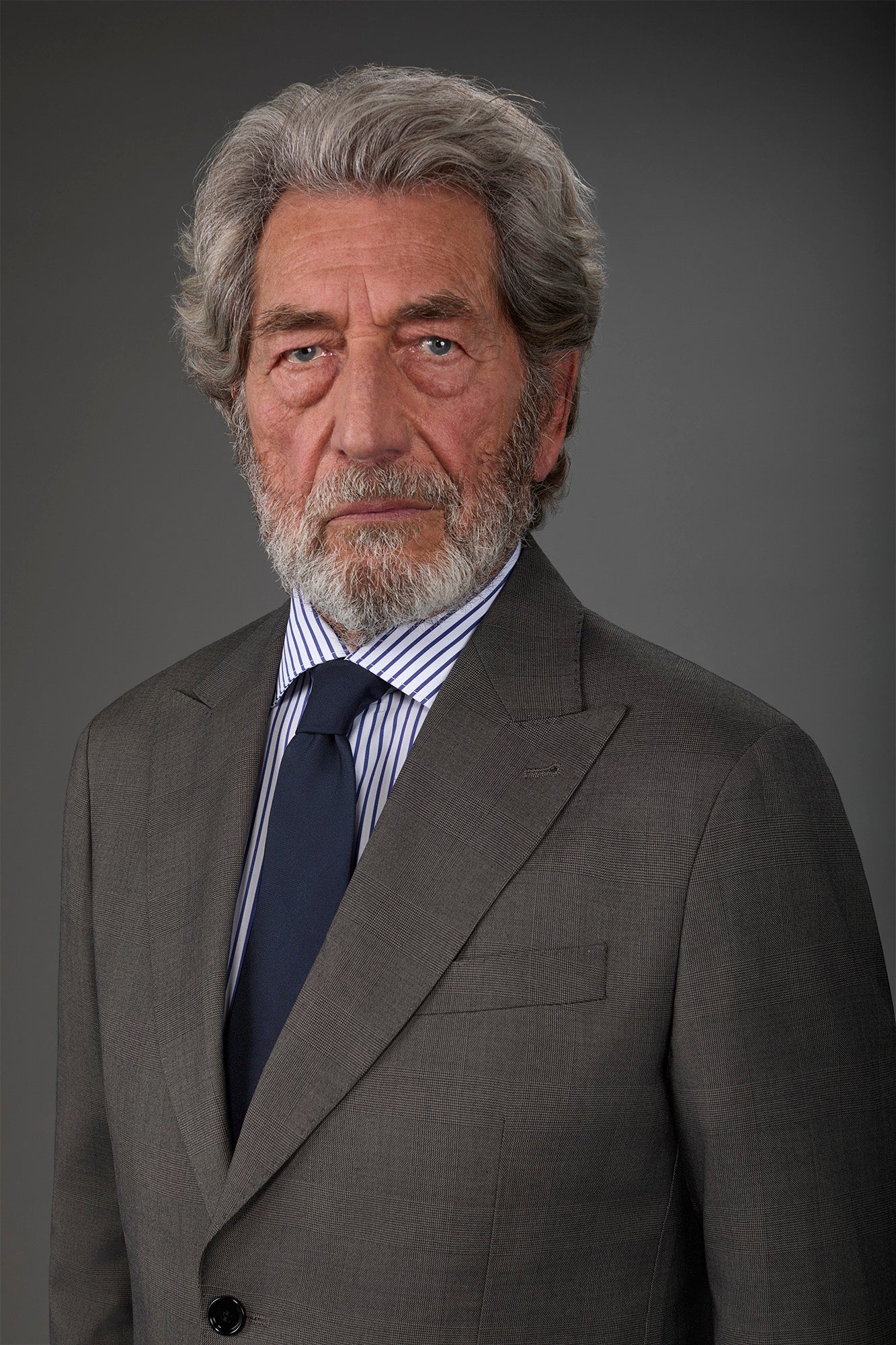 Single-breasted men's suit with single-pleat trousers in Prince of Wales check fabric