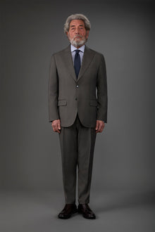 Single-breasted men's suit with single-pleat trousers in Prince of Wales check fabric