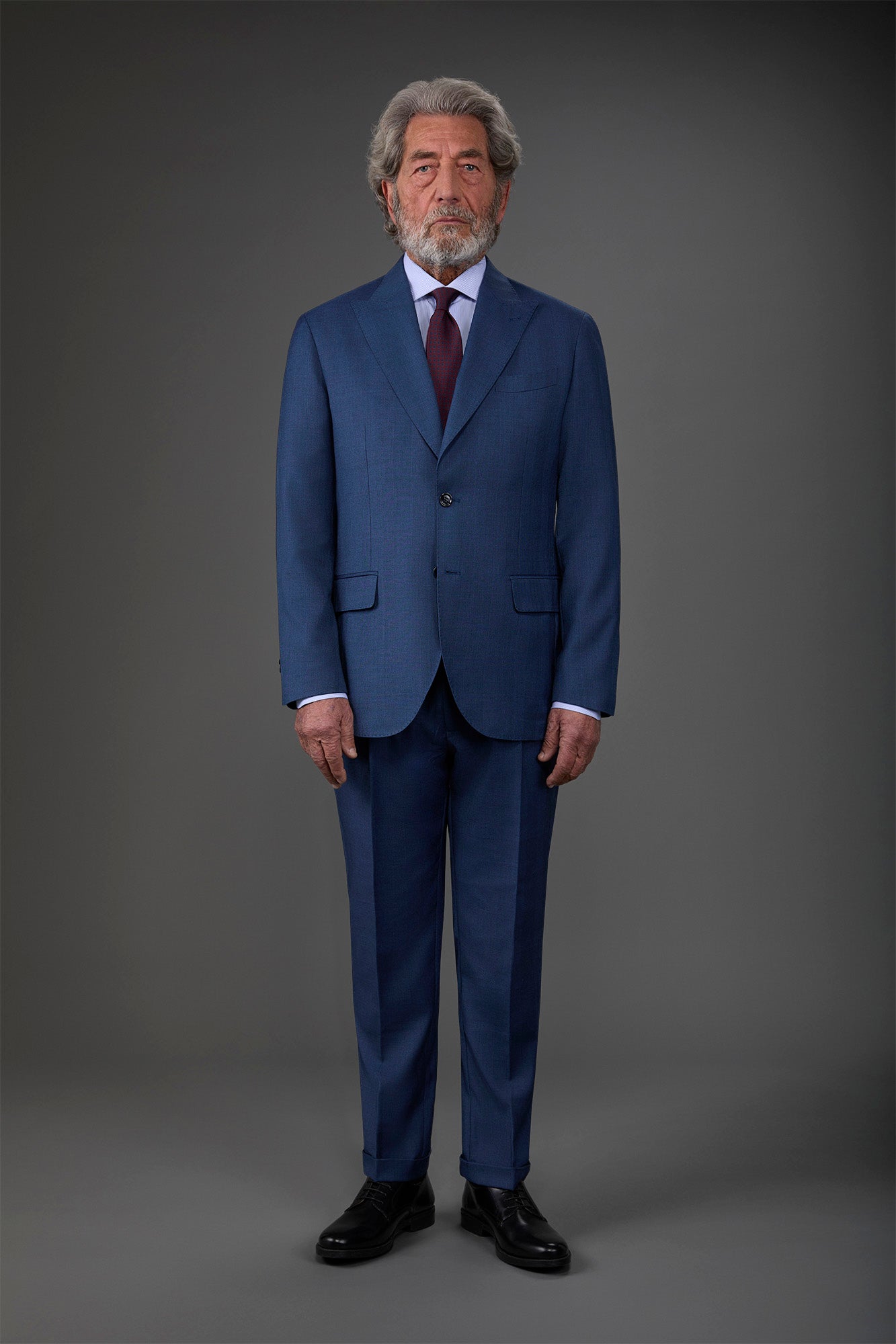 Single-breasted men's suit with single-pleat trousers in Prince of Wales check fabric
