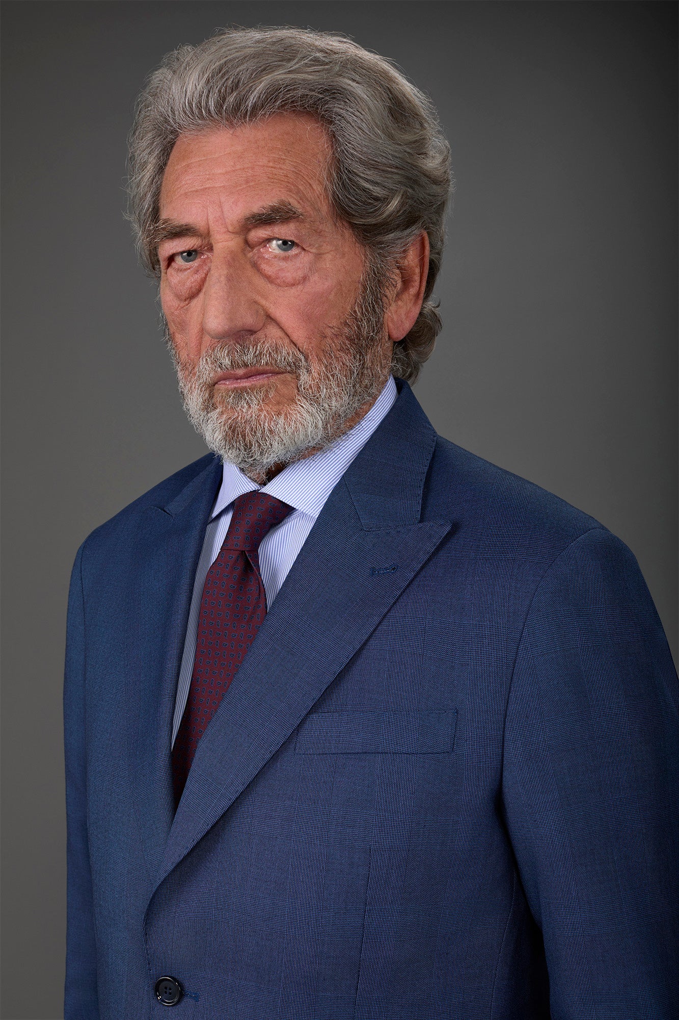 Single-breasted men's suit with single-pleat trousers in Prince of Wales check fabric