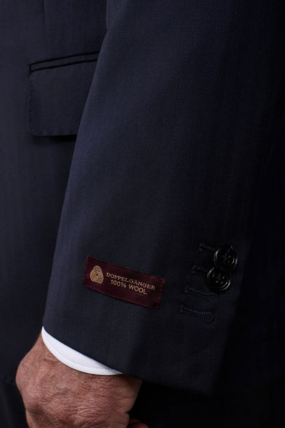 Single-breasted men's suit with classic single-pleat trousers, in pure combed wool with herringbone weave