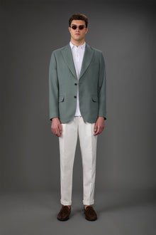 Men's unlined single-breasted jacket with peak lapels and flap pockets. Military