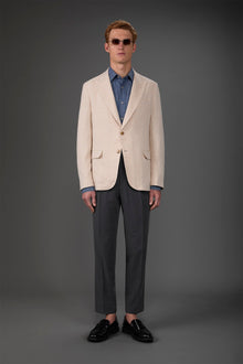 Men's unlined single-breasted jacket with peak lapels and flap pockets. Lt Beige