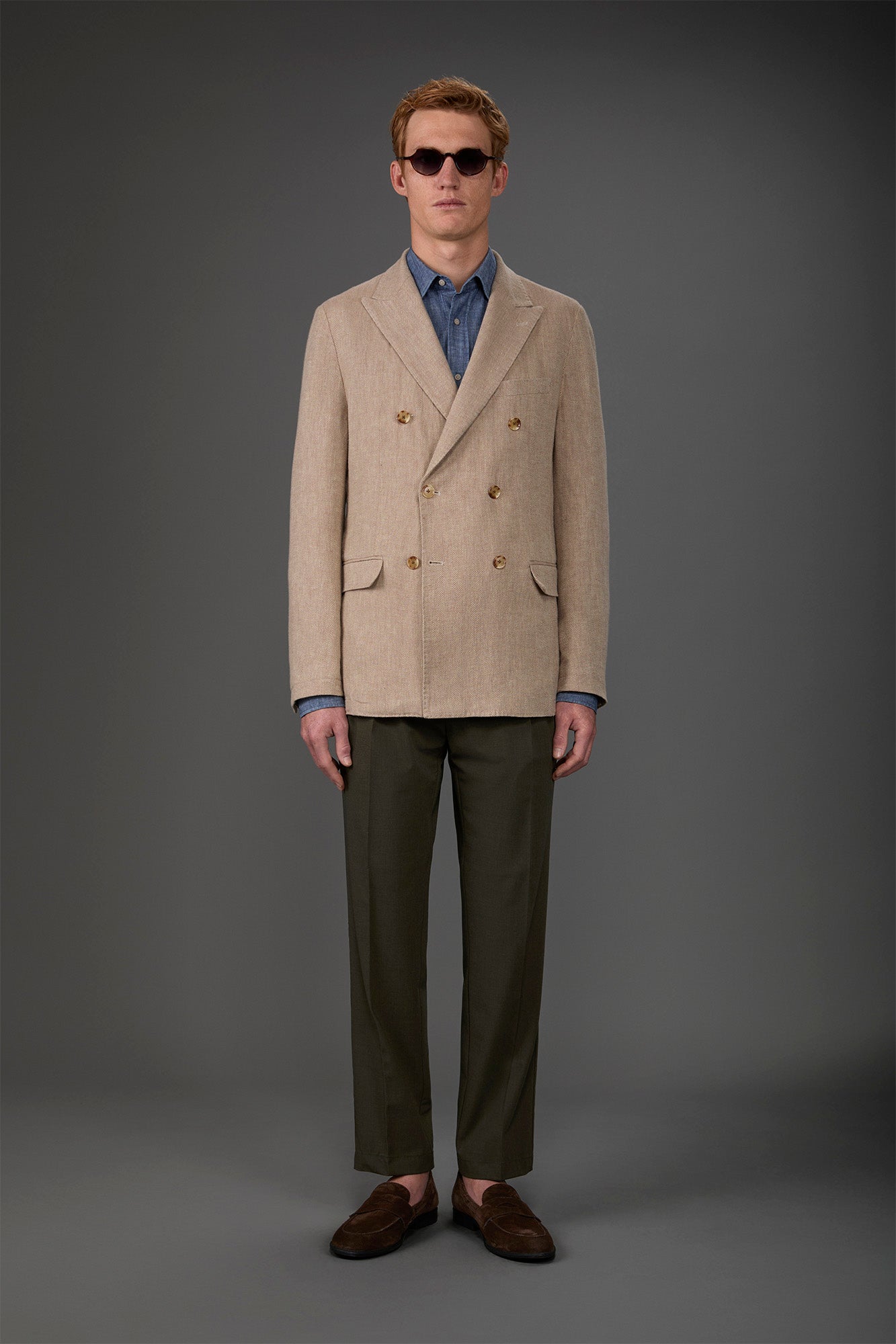 Men's unlined double-breasted jacket with peak lapels and flap pockets. Beige