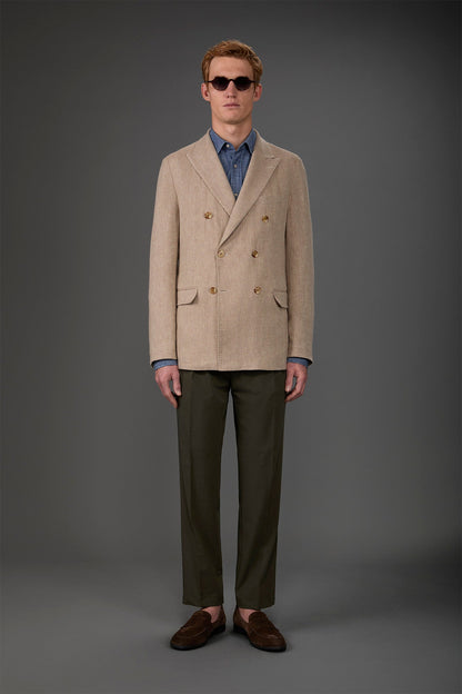 Men's unlined double-breasted jacket with peak lapels and flap pockets. Beige