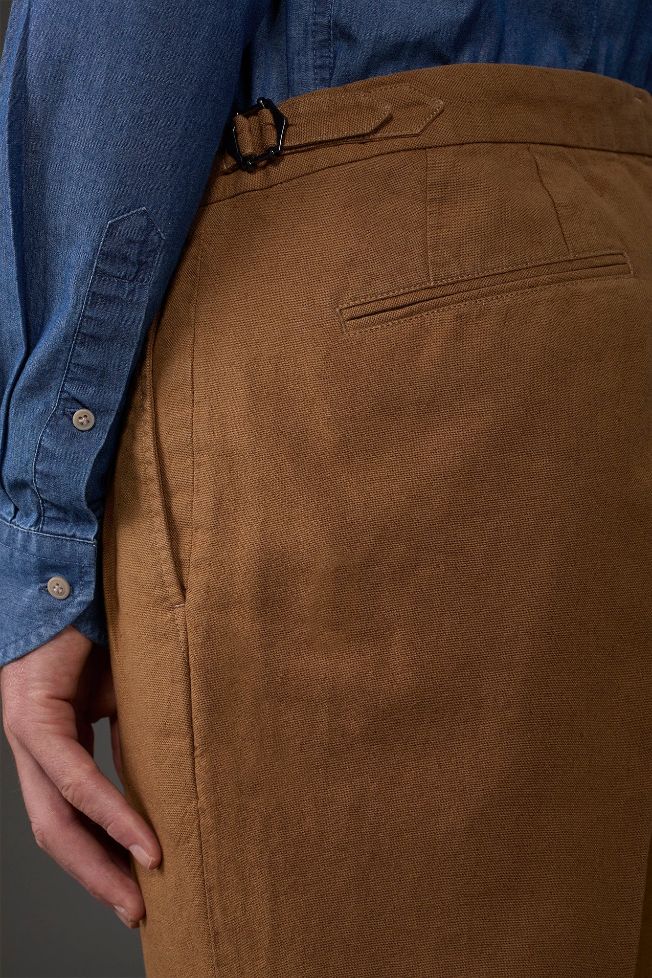 Men's trousers with double pleats and side buckles