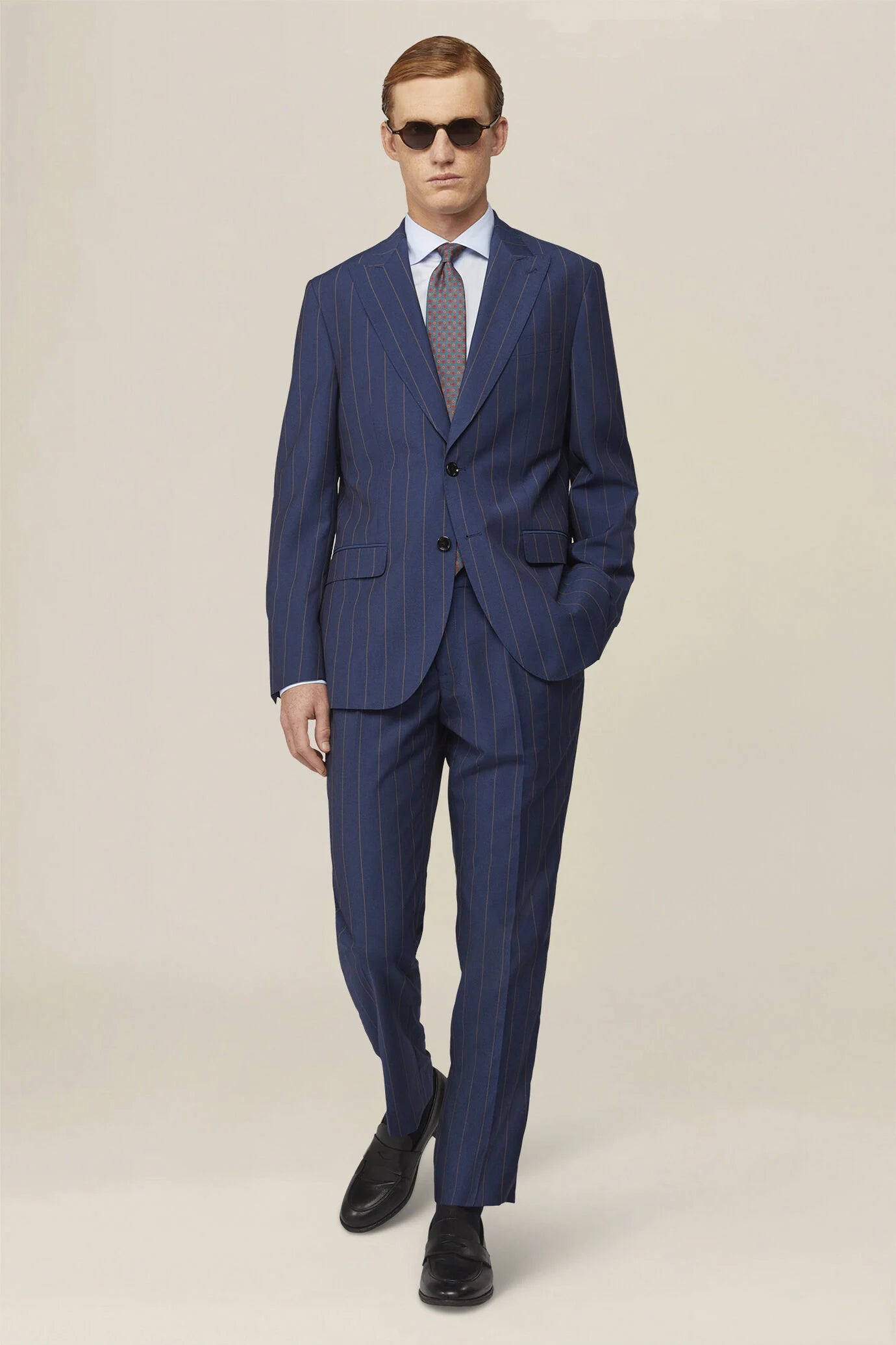 Men's pinstripe suit with double-pleated trousers and peak lapel jacket