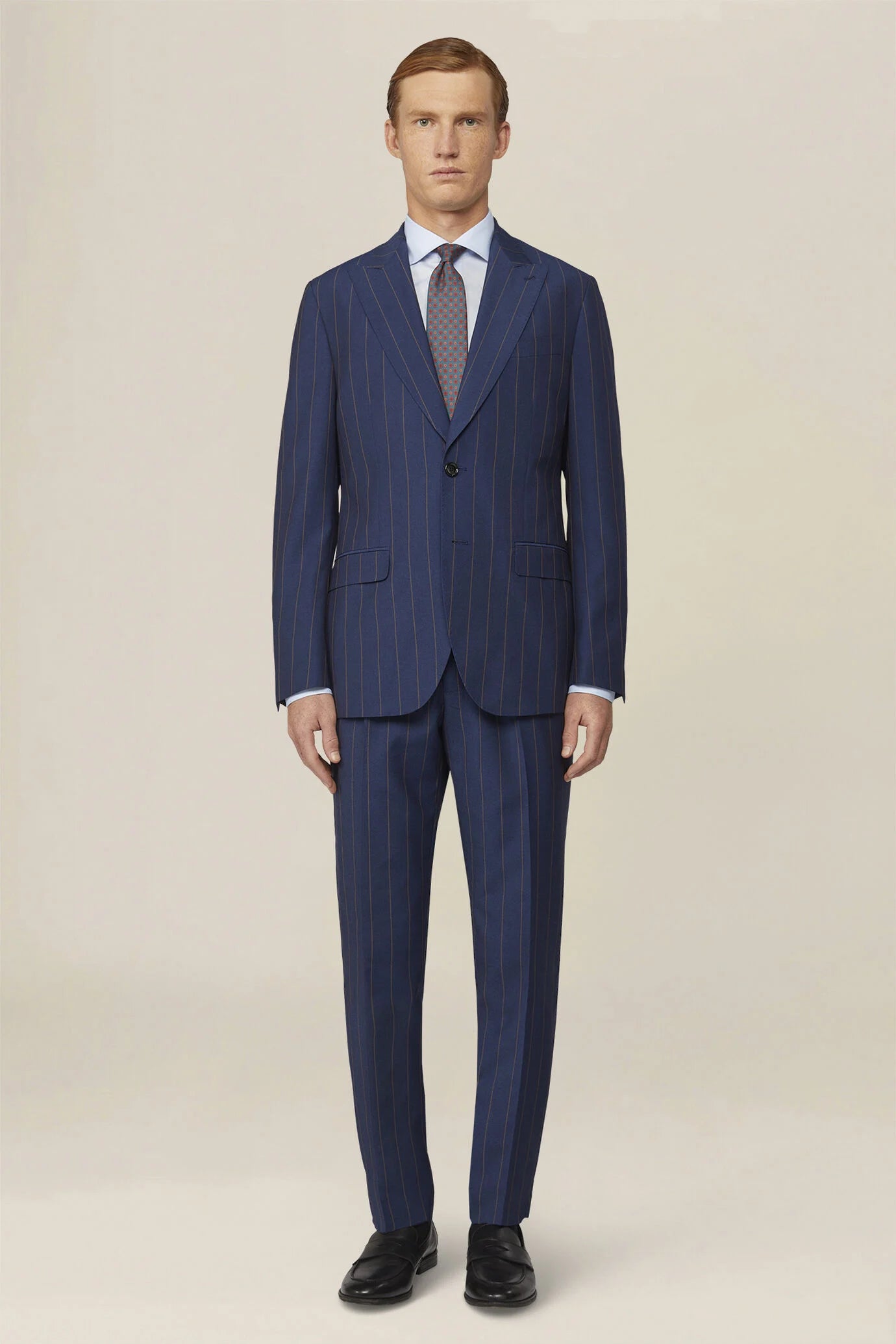 Men's pinstripe suit with double-pleated trousers and peak lapel jacket