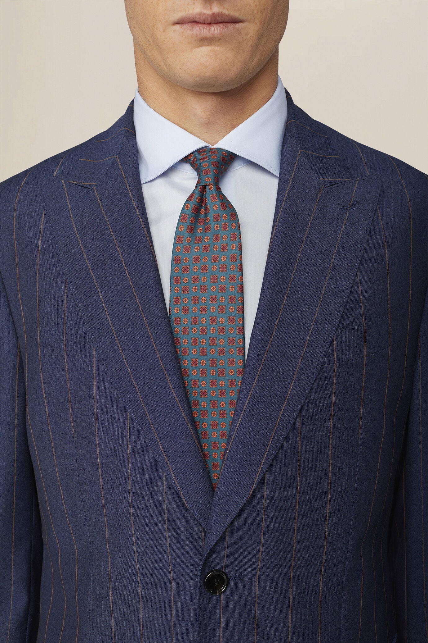 Men's pinstripe suit with double-pleated trousers and peak lapel jacket