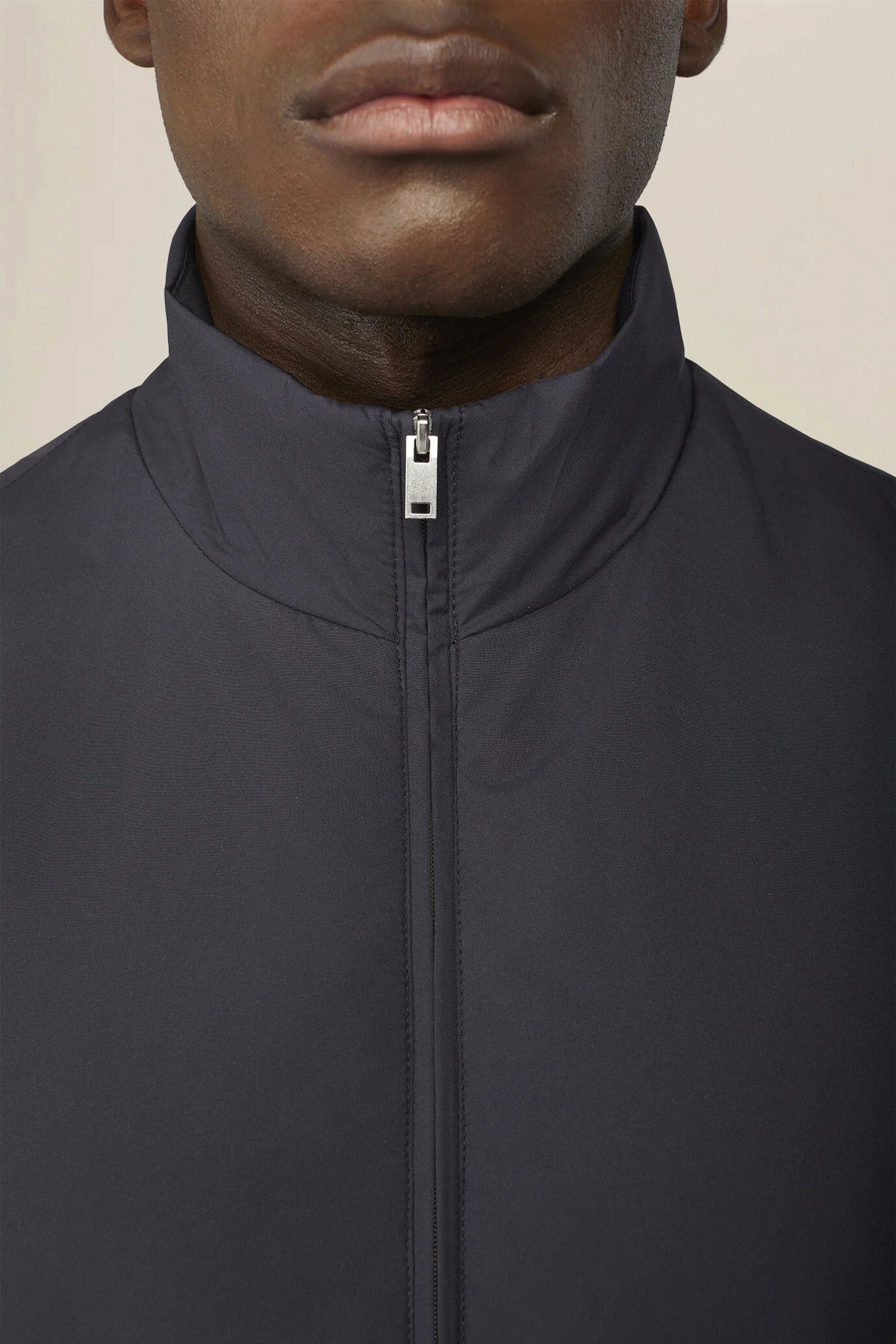 Slightly padded reversible technical fabric sleeveless jacket