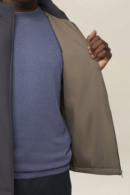 Slightly padded reversible technical fabric sleeveless jacket