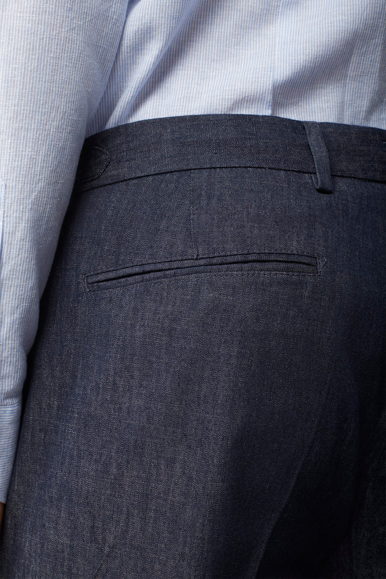 Men's trousers in chambray fabric with double pleats and side buckles